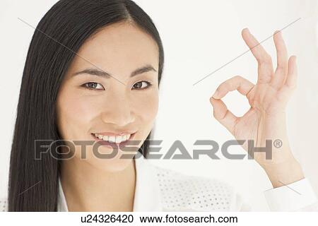 Stock Image - Woman making ok sign. Fotosearch