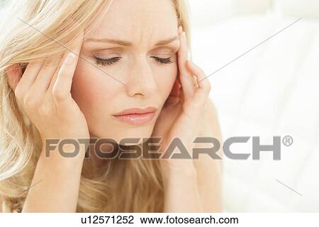 Woman touching head View Large Photo Image Stock Image - Woman touching head. Fotosearch