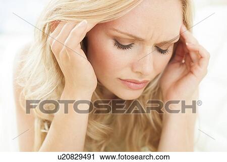 Woman touching head View Large Photo Image Stock Image - Woman touching head. Fotosearch