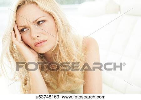 Woman touching head View Large Photo Image Stock Photo - Woman touching head. Fotosearch