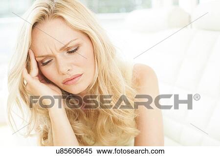 Stock Photography - Woman touching head. Fotosearch