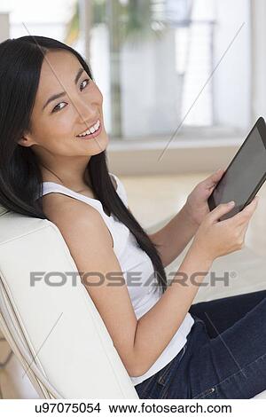 Woman using digital tablet View Large Photo Image Picture - Woman using digital tablet. Fotosearch