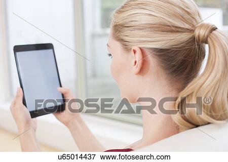 Woman using digital tablet View Large Photo Image Stock Photo - Woman using digital tablet. Fotosearch