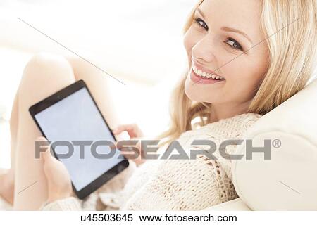 Woman using digital tablet View Large Photo Image Stock Photography - Woman using digital tablet. Fotosearch