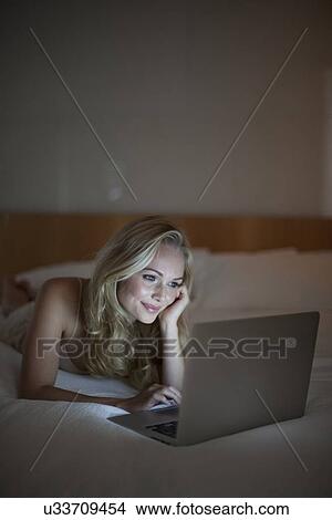 Picture - Woman using laptop. Fotosearch