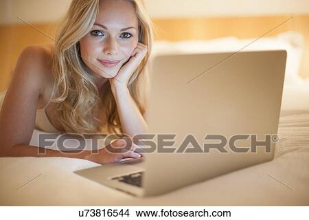 Picture - Woman using laptop. Fotosearch
