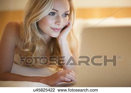 Woman using laptop View Large Photo Image Stock Image - Woman using laptop. Fotosearch