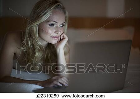 Stock Photo - Woman using laptop. Fotosearch