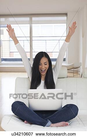 Woman using laptop View Large Photo Image Stock Photo - Woman using laptop. Fotosearch