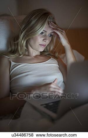 Woman using laptop View Large Photo Image Stock Photo - Woman using laptop. Fotosearch