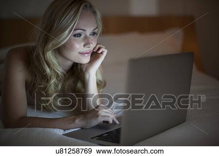 Woman using laptop View Large Photo Image Stock Photo - Woman using laptop. Fotosearch