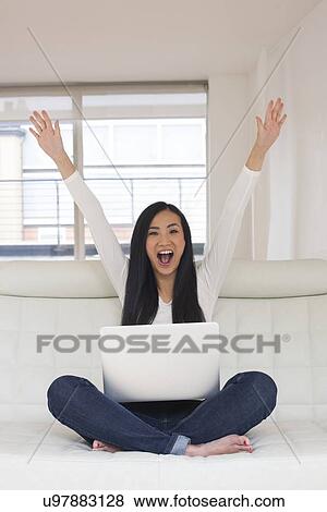 Woman using laptop View Large Photo Image Stock Photo - Woman using laptop. Fotosearch