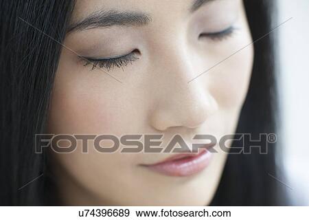 Woman with eyes closed View Large Photo Image Stock Photo - Woman with eyes closed. Fotosearch