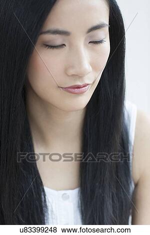 Woman with eyes closed View Large Photo Image Stock Photo - Woman with eyes closed. Fotosearch