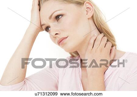 Stock Photo - Woman with hand on neck. Fotosearch