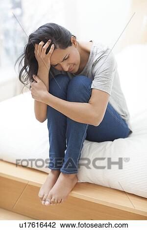 Woman with her head in hands View Large Photo Image Stock Image - Woman with her head in hands. Fotosearch