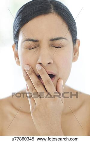 Woman yawning View Large Photo Image Stock Photography - Woman yawning. Fotosearch