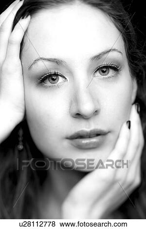 Stock Photo - Hands on a face. Fotosearch