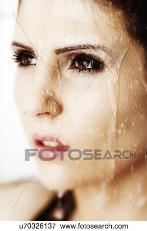 Stock Photo - Looking away in the shower . Fotosearch