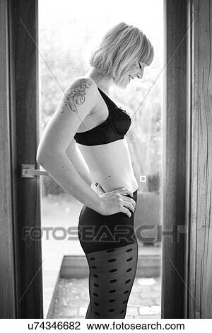 Stock Image - Woman in a bra and tights . Fotosearch