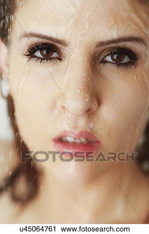 Stock Image - Woman in shower. Fotosearch