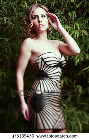 Stock Image - Woman wearing a dress. Fotosearch