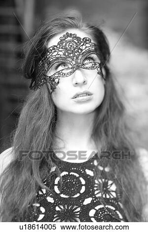 Woman wearing a mask View Large Photo Image Stock Photography - Woman wearing a mask . Fotosearch