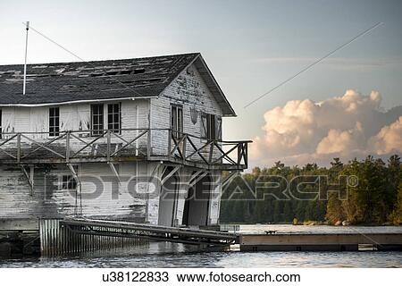 Abandoned Boat house at the lakeside, Kenora, Lake of The Woods, Ontario, Canada View Large Photo Image Stock Image - Abandoned Boat house at the lakeside, Kenora, Lake of The Woods, Ontario, Canada. Fotosearch