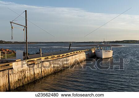 Stock Image - Boat at dock, North Rustico, Prince Edward Island, Canada. Fotosearch