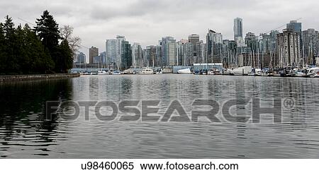 Stock Photography - Boats at harbor, Coal Harbour, with Vancouver city skyline, British Columbia, Canada. Fotosearch