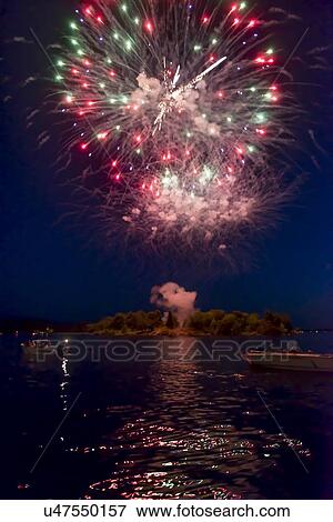 Stock Photo - Canada Day firework display, Keewatin, Unorganized Kenora, Kenora, Lake of The Woods, Ontario, Canada. Fotosearch