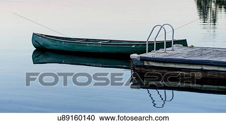 Canoe at a dock in a lake, Lake of The Woods, Ontario, Canada View Large Photo Image Stock Image - Canoe at a dock in a lake, Lake of The Woods, Ontario, Canada. Fotosearch