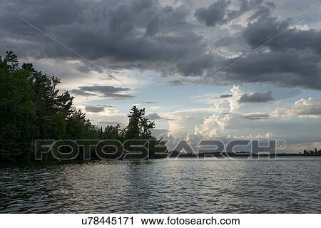 Clouds over a lake, Lake of The Woods, Ontario, Canada View Large Photo Image Stock Image - Clouds over a lake, Lake of The Woods, Ontario, Canada. Fotosearch