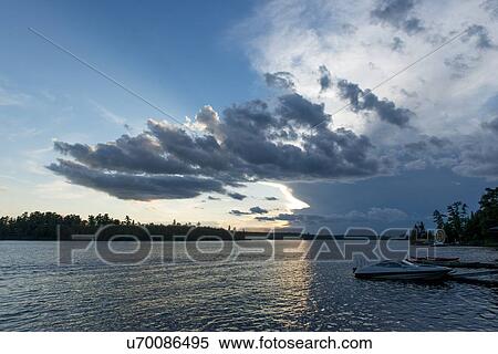 Clouds over a lake, Lake of The Woods, Ontario, Canada View Large Photo Image Stock Photography - Clouds over a lake, Lake of The Woods, Ontario, Canada. Fotosearch