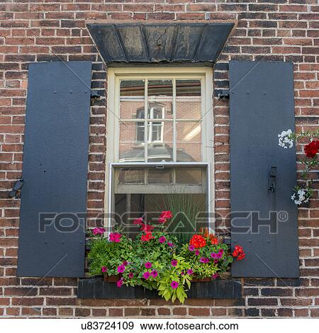 Stock Photo - Detail of a window with flowers, Charlottetown, Prince Edward Island, Canada. Fotosearch