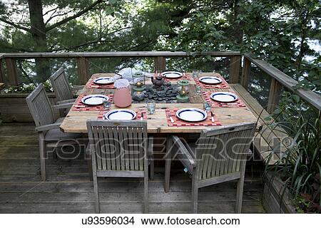 Picture - Dining table at the terrace, Lake of The Woods, Ontario, Canada. Fotosearch