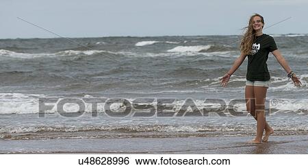 Girl enjoying on the beach, Prince Edward Island, Canada View Large Photo Image Stock Photograph - Girl enjoying on the beach, Prince Edward Island, Canada. Fotosearch