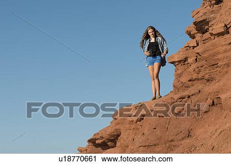 Girl standing on cliff at coast, Green Gables, Cavendish, Prince Edward Island, Canada View Large Photo Image Stock Image - Girl standing on cliff at coast, Green Gables, Cavendish, Prince Edward Island, Canada. Fotosearch