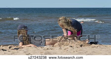 Stock Photo - Girls on the beach, Cavendish Beach, Green Gables, Prince Edward Island, Canada. Fotosearch