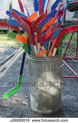 Hockey sticks in a garbage bin, Lake of The Woods, Ontario, Canada View Large Photo Image Stock Photograph - Hockey sticks in a garbage bin, Lake of The Woods, Ontario, Canada. Fotosearch
