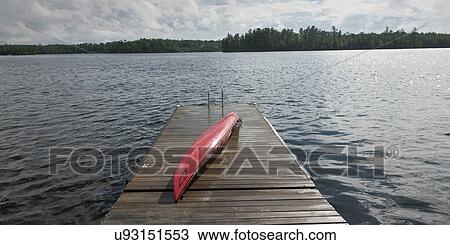 Stock Image - Kayak on a boardwalk, Lake of The Woods, Ontario, Canada. Fotosearch