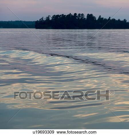 Stock Photo - Lake at dusk, Clearwater Bay, Lake of The Woods, Keewatin, Ontario, Canada. Fotosearch