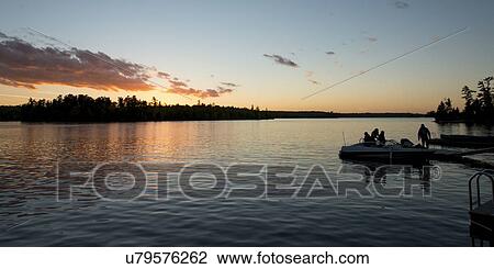 Stock Image - Lake at dusk, Lake of The Woods, Ontario, Canada. Fotosearch