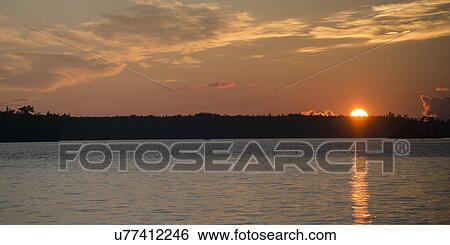 Lake at sunset, Lake of The Woods, Ontario, Canada View Large Photo Image Stock Photograph - Lake at sunset, Lake of The Woods, Ontario, Canada. Fotosearch