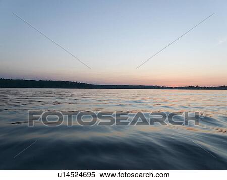 Lake surface at dusk, Lake of The Woods, Ontario, Canada View Large Photo Image Stock Photography - Lake surface at dusk, Lake of The Woods, Ontario, Canada. Fotosearch