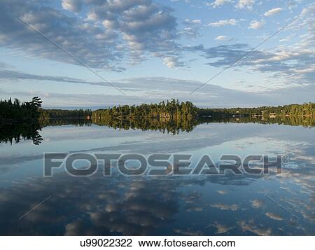 Reflection of clouds on water, Lake of The Woods, Ontario, Canada View Large Photo Image Stock Image - Reflection of clouds on water, Lake of The Woods, Ontario, Canada. Fotosearch