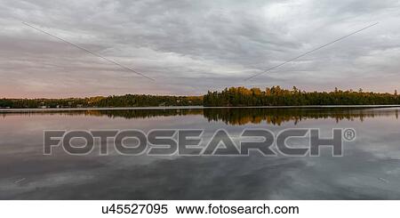Reflection of clouds on water, Lake of The Woods, Ontario, Canada View Large Photo Image Stock Photography - Reflection of clouds on water, Lake of The Woods, Ontario, Canada. Fotosearch