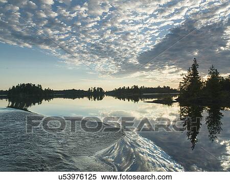 Reflection of clouds on water, Lake of The Woods, Ontario, Canada View Large Photo Image Stock Photography - Reflection of clouds on water, Lake of The Woods, Ontario, Canada. Fotosearch