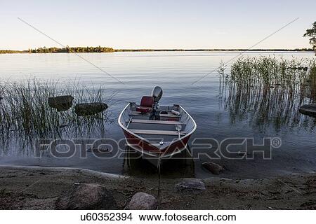 Rowboat in a lake, Lake of The Woods, Ontario, Canada View Large Photo Image Picture - Rowboat in a lake, Lake of The Woods, Ontario, Canada. Fotosearch