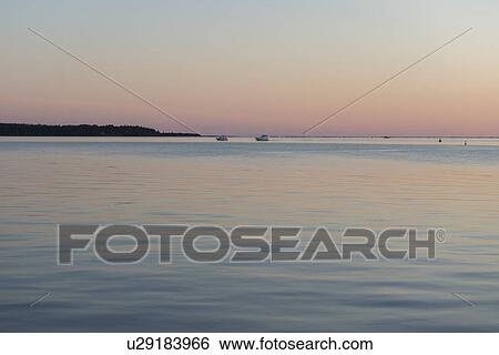 Stock Photograph - Sea at sunset, Spinnakers Landing, Summerside, Prince Edward Island, Canada. Fotosearch